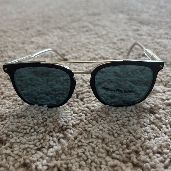 TOD'S Stylish Black Sunglasses with Silver Accents